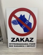 Znak bilbord szyld baner zakaz wyprowadzania psów bez kagańca i smyczy