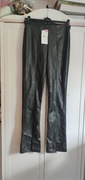 Legginsy eko skóra lekko rozszerzane i rozcięte nogawki Sinsay r. XL nowe 
