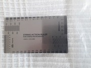 String action, płytka, miarka do pomiaru gitary, np. akcji strun