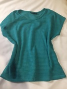 Esmara. Zielona delikatnie prześwitująca bluzka z krótkim rękawem