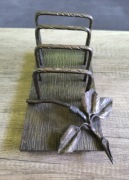 metalowy stojak na książki art deco