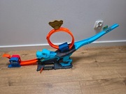Hot Wheels City Atak Dinozaura T-Rex + Samochodzik Wyrzutnia HKX42
