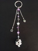 Brelok kot donut pączkot biało-czarny fioletowy gwiazdy łapka 