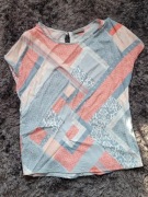 Pastelowa bluzka z guziczkiem 36