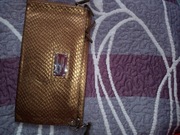 sprzedam złotą kopertówkę Sabriny Pilewicz