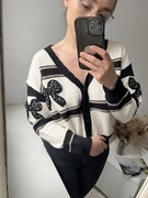 Krótki, czarno-kremowy kardigan w kokardki