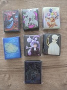 Pokemon TCG koszulki na karty 7x65szt NOWE różne wzory Charizard Mewtwo 