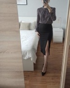 Nowa , elegancka spódnica midi , czarna z rozcięciem 