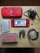 Nintendo Switch OLED Mario RED, cztery gry, etui, karta SC 128GB
