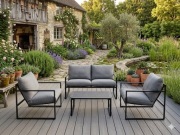 Zestaw ogrodowy sofa dwa fotee stolik szare.
