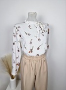 Elegancka bluzka na długi rękaw wiązana w kwiatki z wiskozy na okazję