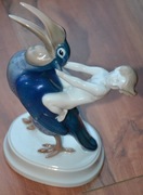 Kolekcionerski Putto na tukanie figurka porcelanow