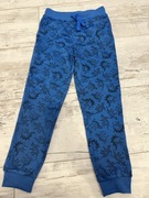 Dresowe spodnie niebieskie dinozaury 128 7-8 lat