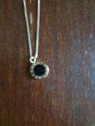 Złoty łańcuszek i pozłacany wisiorek "czarne słońce"