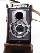 Części do starego aparatu fotograficznego Reflekta II i futerał.