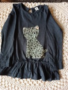 Bluzka z długim rękawkiem z falbanką.