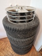 Opony zimowe z felgami i oryginalnymi kołpakami Opel Insignia . Rozmiar 17