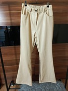 Spodnie dzwony eko skóra kremowe. Lekko ocieplane