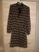 Elegancka sukienka z cekinowym wiązaniem 