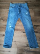 Diesel Tepphar Jeansy męskie Carrot Slim W33 L30 niebieskie przecierane 