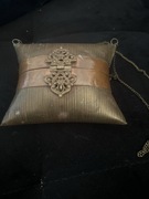 Mosiężna torebka dla lalki