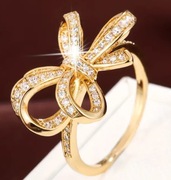 Pierścionek r. 10 złoty z cyrkoniami kokardka + pudełko