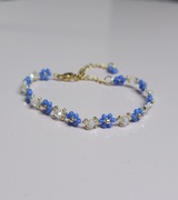 Pleciona bransoletka kwiatki jasnoniebieska