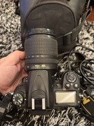 Aparat Nikon d7000 z obiektywem VR 18-105 i ladowarka oraz etui