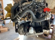  Silnik z osprzętem. Bobcat,Torro Peugot xud9