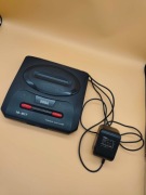 Sega Mega Drive z zasilaczem