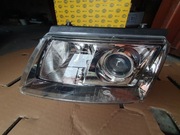 Lampa nowa lewa Passat B5 96-00 soczewka HELLA