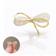 Broszka ozdobna - złota KOKARDA, cyrkonie