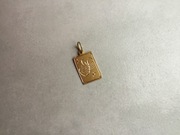 wisiorek ze znakiem zodiaku, wykonany ze złota