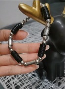 Bransoletka w kolorze czarno-srebrnym. Unisex 