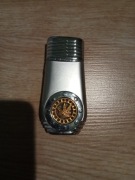 Metalowa zapalniczka żarowa z motywem liścia konopi.