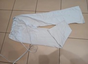 Białe spodnie dzwony z wysokim stanem 