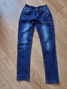 Jeansy dla dziewczynki granatowe gumka cekiny kwiatki 146 152