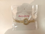 Złoty damski zegarek biżuteryjny z kryształkami – elegancki styl klasyczny