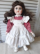 Lalka porcelanowa Alberon z pozytywką