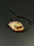 Bransoletka z bursztynem rzeźbionym kwiaty regulowana