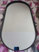 Owalne lustro w czarnej, grubszej ramie