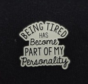 Przypinka pin button being tired