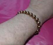 Bransoletka z pereł słodkowodnych – odcień złoto-lilowy