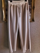 Spodnie damskie szerokie beżowe białay lampas z kieszeniami typ masełko