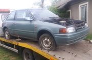 Mazda 323 BG IV Zderzak drzwi szyba
