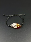 Bransoletka z bursztynem rzeźbionym róże regulowana