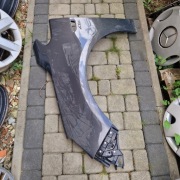 Opel Astra J blotnik przod lewy 13390002 oryginał Z177 do lakieru