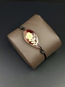 Bransoletka z bursztynem rzeźbionym kwiat regulowana