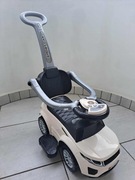 Jeździk pchacz chodzik dla dziecka Schowek Podnóżek Obejma Dźwięk Sport Car