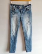 Jeansy spodnie damskie skinny niebieskie jasne rurki przetarcia w32
